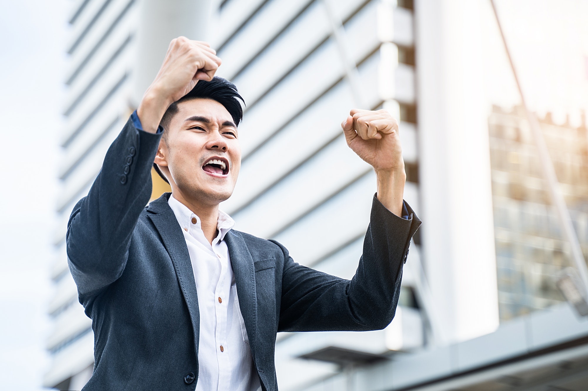 Asian businessman feeling happy after the result of interview test for job application is passed.